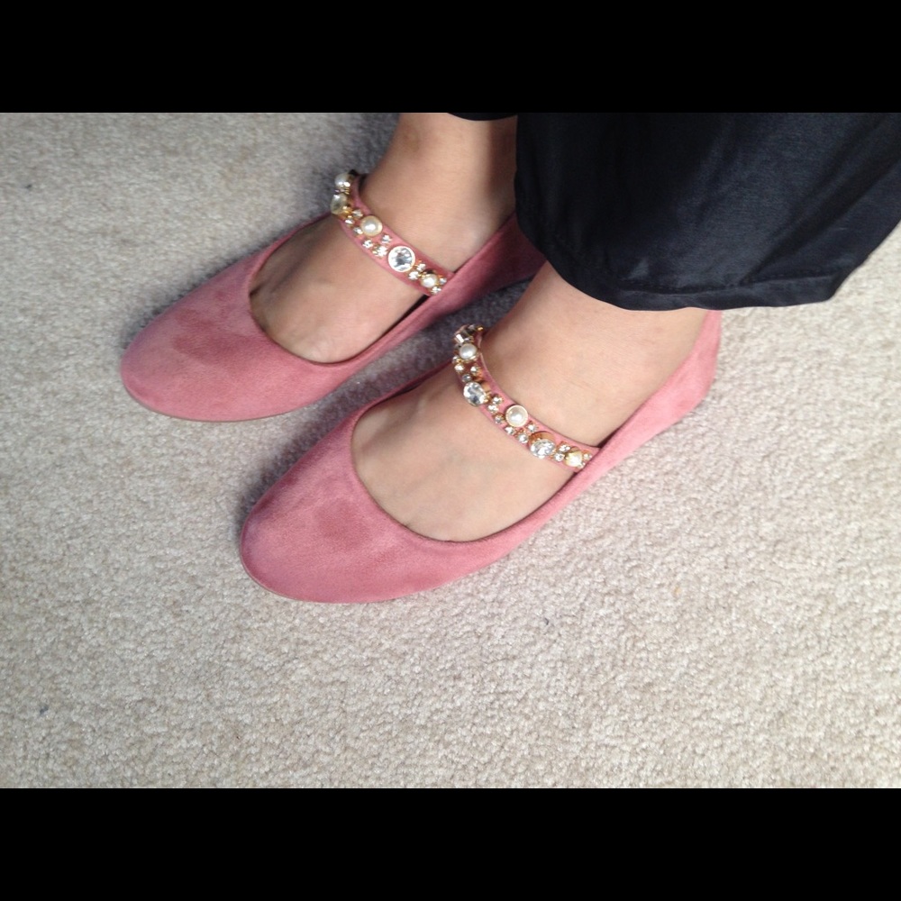 Flats with embellished strap.